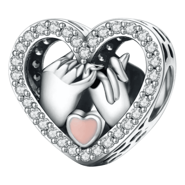 Voor en Achteraanzicht van onze best seller handen samen in hart. De handjes in het hart zijn mooi gepolijst en gemaakt van 925 sterling zilver. Samen met roze emaille hartje en over het gehele hart met zirkonia ingelegde bead maakt deze bedel een echt eyecatcher aan je armband. Valentijn alert!